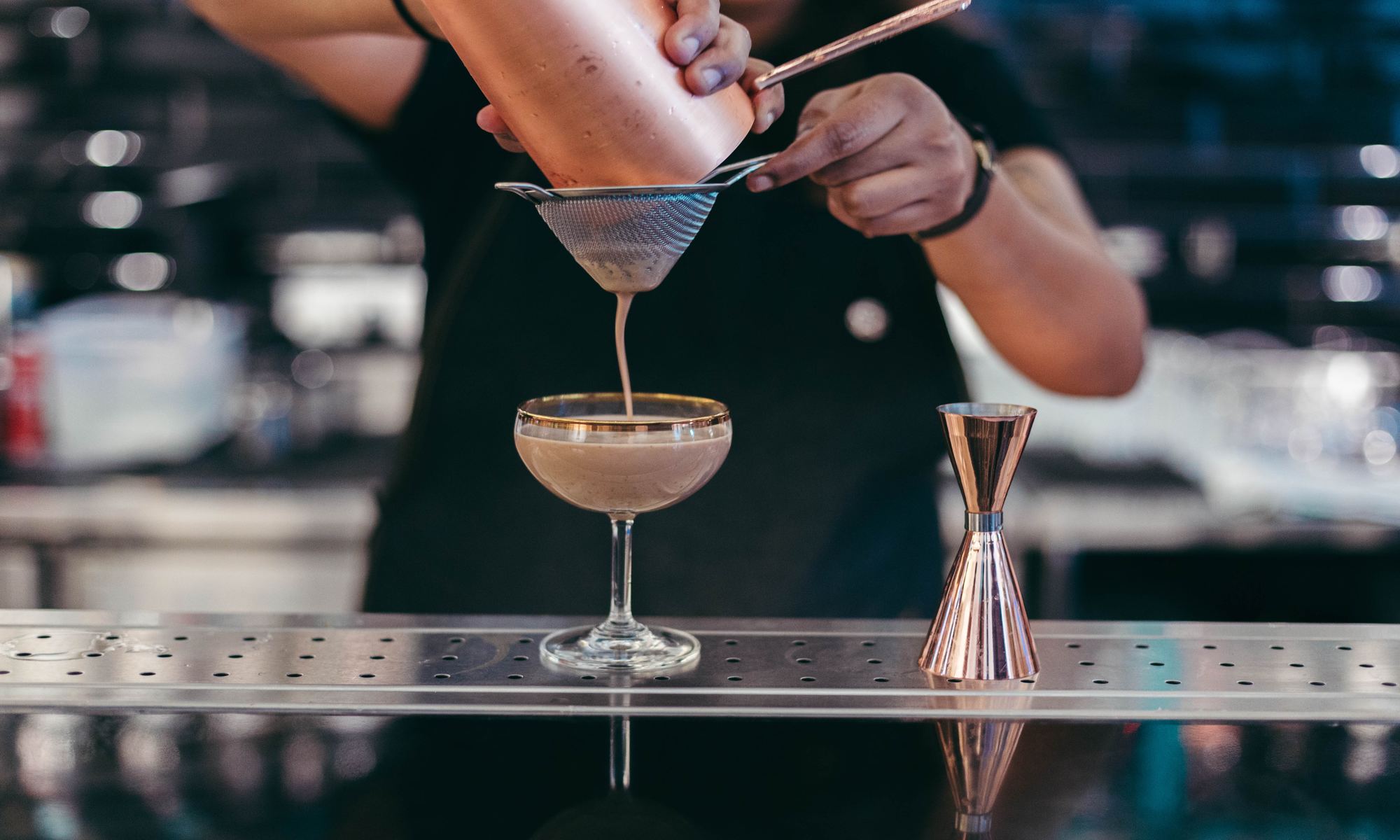 bartender pouring a drink