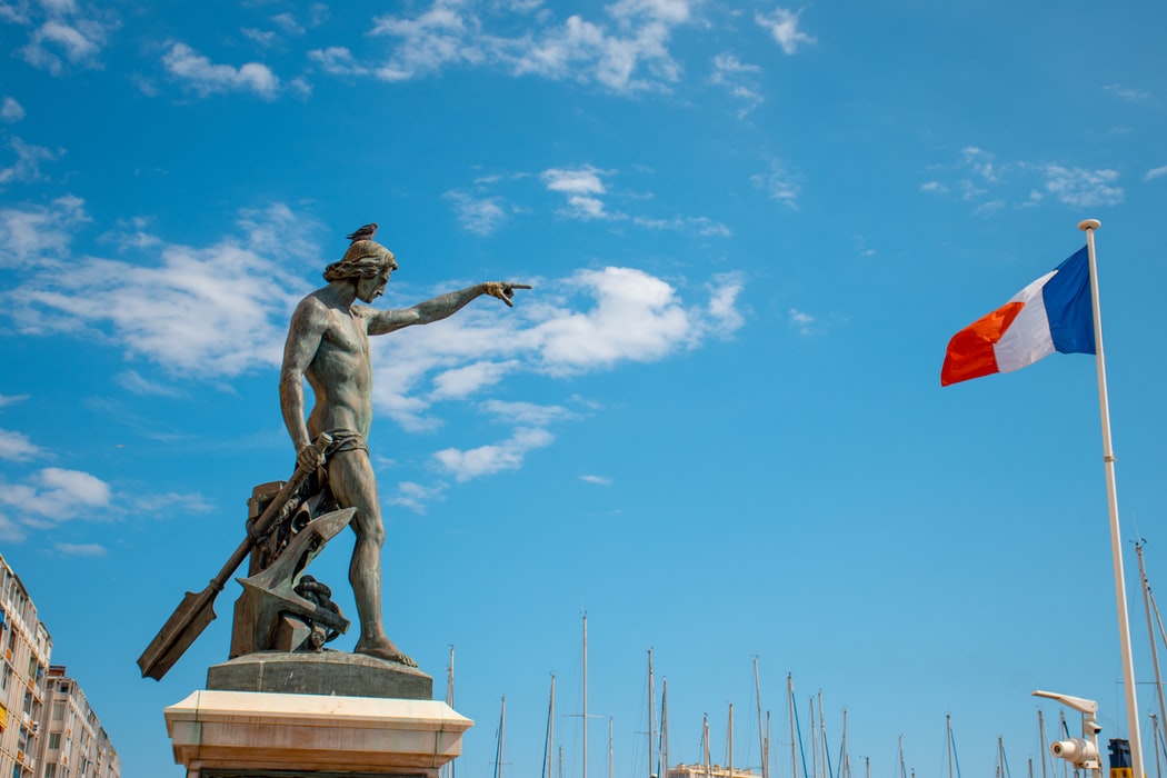Statue and flag of France