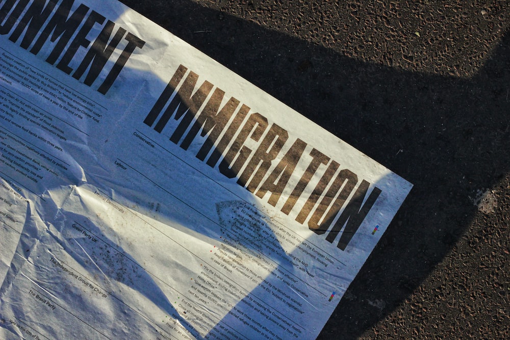 white printed paper on the road.