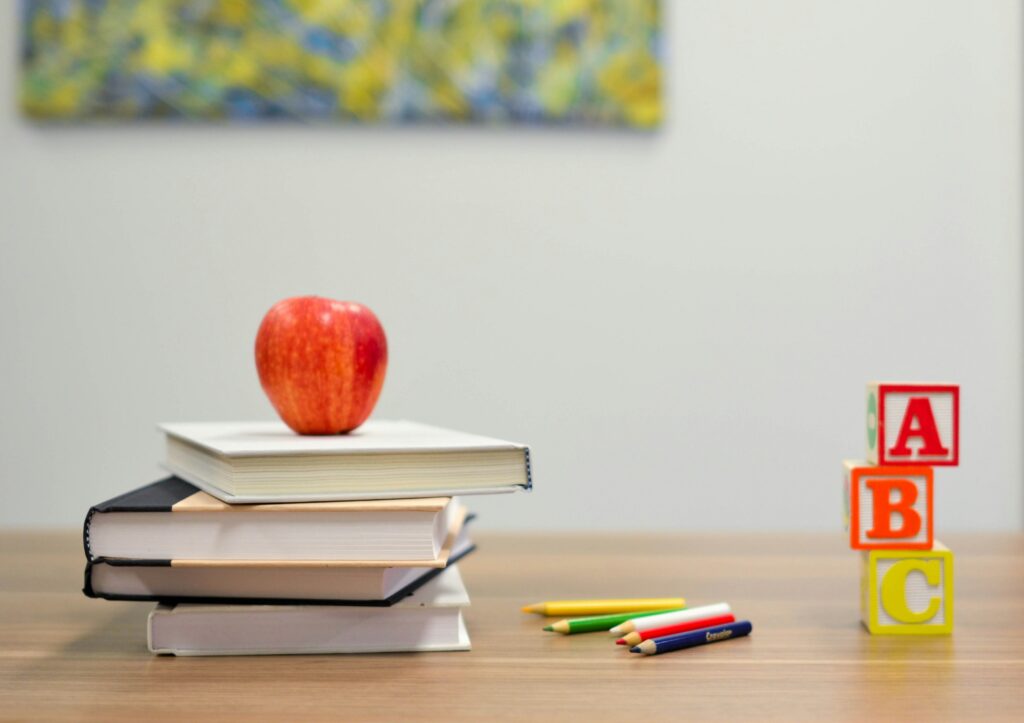 books and toys and an apple