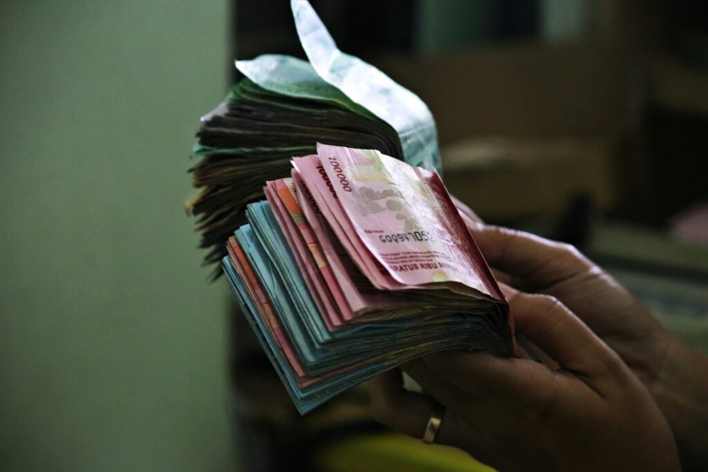 A man counting money notes