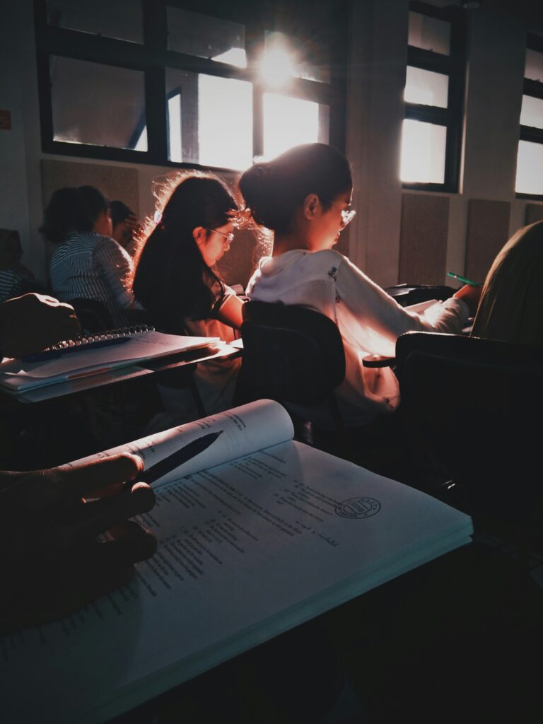 students reading their books in class